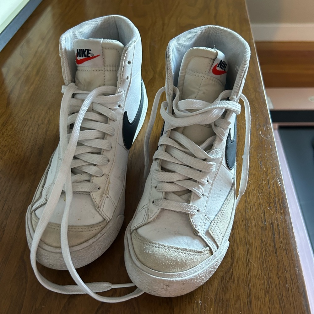 Nike White High-Top Sneakers with Black Swoosh